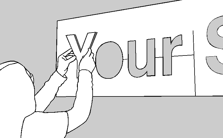 Dimensional letter placed into the adhesive pattern slot and pressed onto the wall