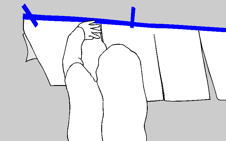 Bottom backing peeled from the adhesive installation pattern while pressing it to the wall
